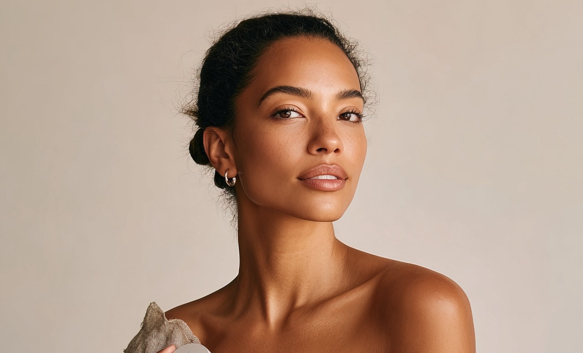 Beautuful woman with radiant, hydrated skin after using Island Peppa products
