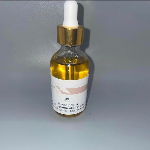 Bottle of Natural Hair Oil with Aloe for strengthening and nourishing hair
