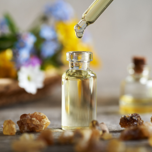 Stock photo of herbal Natural Pain Relief Tincture in glass dropper.