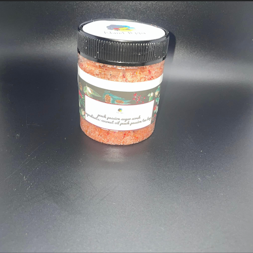 Jar of Passion Mango Sugar Scrub for glowing, smooth skin.